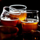 People raising beer glasses for a cheers